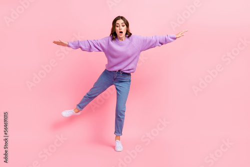 Full length photo of shocked impressed girl dressed purple pullover having fun arms sides isolated pink color background