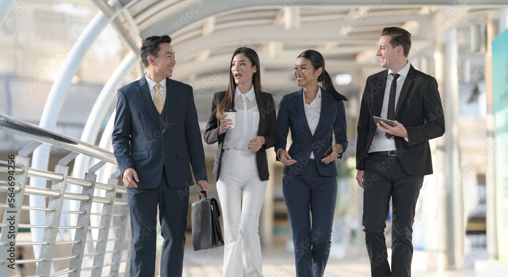 Business people walking and talk to each other in front of modern office Business people walking and talk to each other in front of modern office