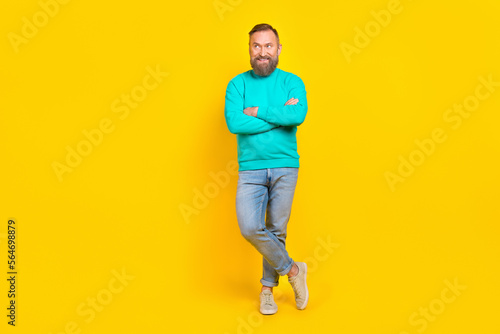 Full length photo of nice retired man folded arms look empty space banner wear trendy aquamarine outfit isolated on yellow color background