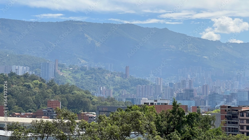 panorama of the city of medellin and mountains with ble clear sky