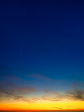 Color gradient on the sky. Sky with clouds during sunset. Clouds and blue sky. Photo for design and background.