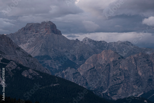 Dolomite mountain Croda Rossa under a cloudy sky at dusk