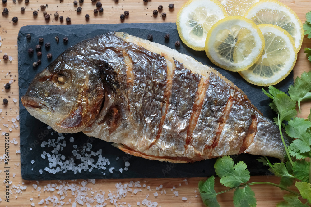 Grilled dorado, tasty and juicy fish ready to eat close-up