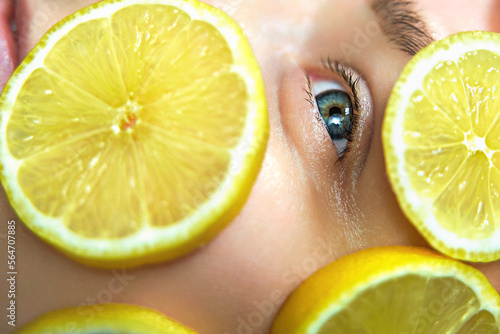 close up of woman holding lemon