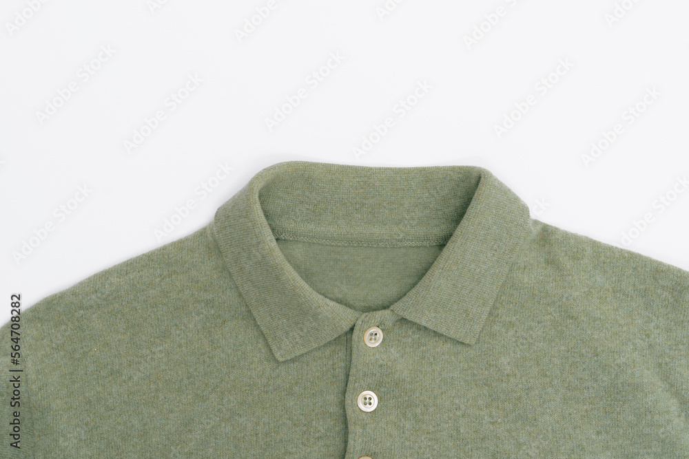 Green wool sweater collar with buttons on white isolated background top view. Template for your design Green wool sweater collar with buttons on white isolated background top view. Template for your design