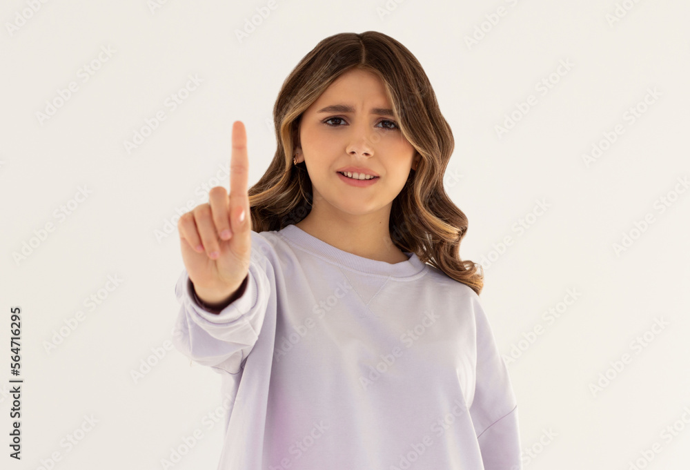 Serious and angry caucasian woman telling to stop, frowning and showing finger in disapproval, prohibit something, standing in dress against white background Serious and angry caucasian woman telling to stop, frowning and showing finger in disapproval, prohibit something, standing in dress against white background