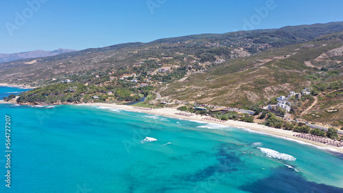 Fototapeta Naklejka Na Ścianę i Meble -  Aerial drone photo of famous wavy beach of Mesakti ideal for wind surfing in island of Ikaria, Aegean, Greece