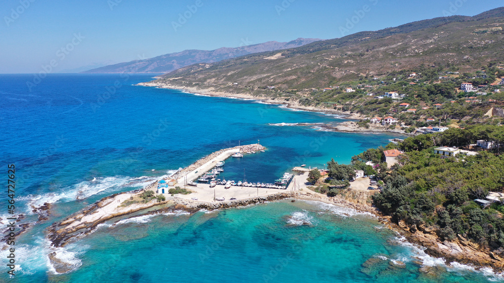 Aerial drone photo of picturesque small seaside church of Analipsi built in small port of Gialiskari, Ikaria island, Aegean, Greece