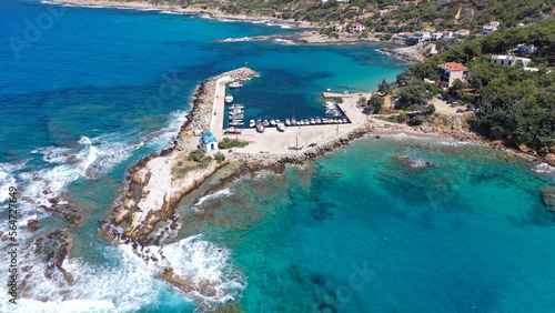 Fototapeta Naklejka Na Ścianę i Meble -  Aerial drone photo of picturesque small seaside church of Analipsi built in small port of Gialiskari, Ikaria island, Aegean, Greece