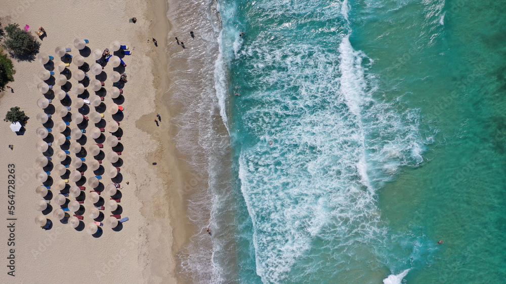 Aerial drone photo of famous wavy beach of Mesakti ideal for wind surfing in island of Ikaria, Aegean, Greece Aerial drone photo of famous wavy beach of Mesakti ideal for wind surfing in island of Ikaria, Aegean, Greece