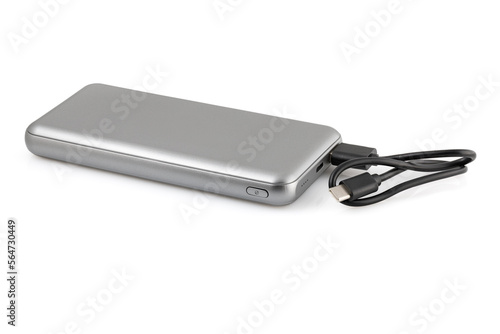 Additional autonomous power bank for charging mobile devices. External battery isolated on white background. Silver charger for a smartphone with a power supply  battery . Full depth of field.