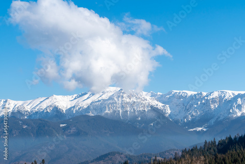 Titlis mountain. Beautiful panorama of snowy alps in white-blue tones.