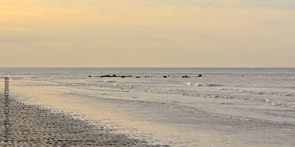 Belgian northsea coast with rocks on a winter evening