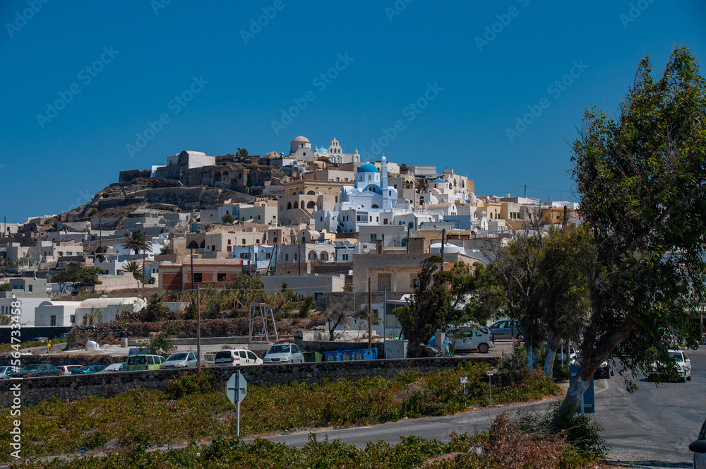 Houses by a road on the island of Santorini during a beautiful day in the summer