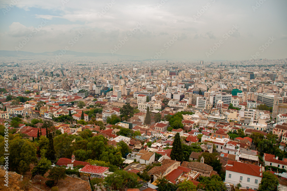 Fototapeta premium The city of Athens from the Parthenon on a cloudy day in the summer 