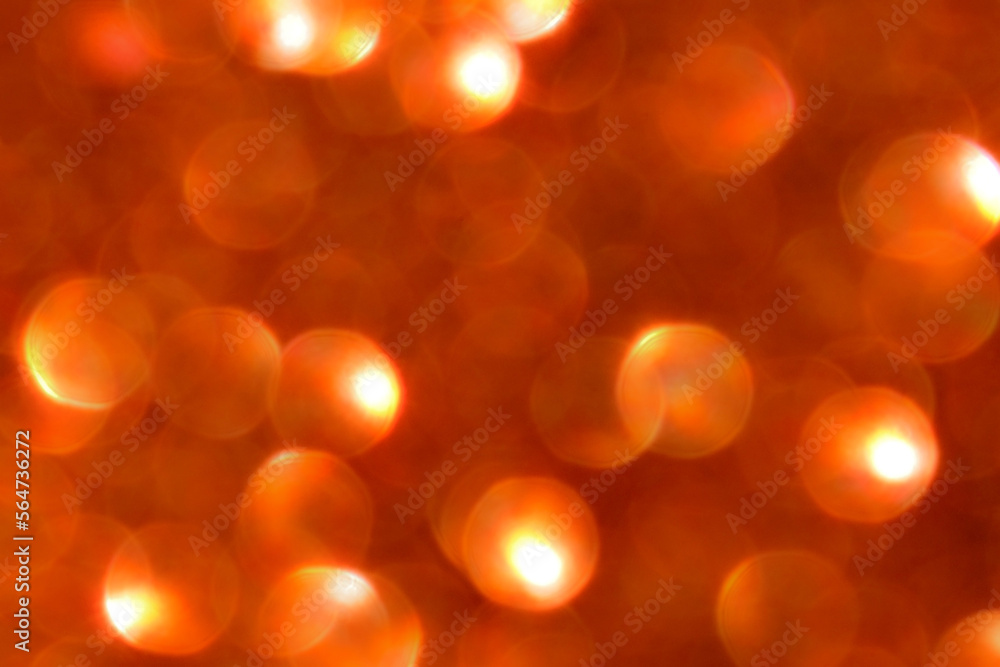Obraz premium Orange brown bokeh background. Photo can be used for the concept of New Year, Christmas, Summer season and all celebration backgrounds. 