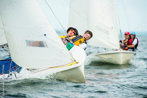 Teenagers enjoying sailing on boat on Narragansett Bay photo
