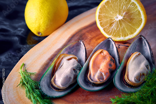 mussels open on a wooden platter