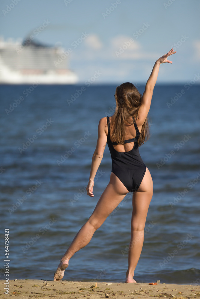 beauty athletic woman in a swimsuit on the beach beauty athletic woman in a swimsuit on the beach