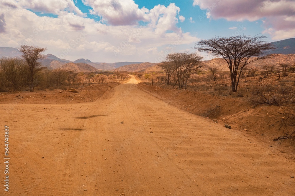 A dirt road against the background of Ndoto Mountains in Kenya