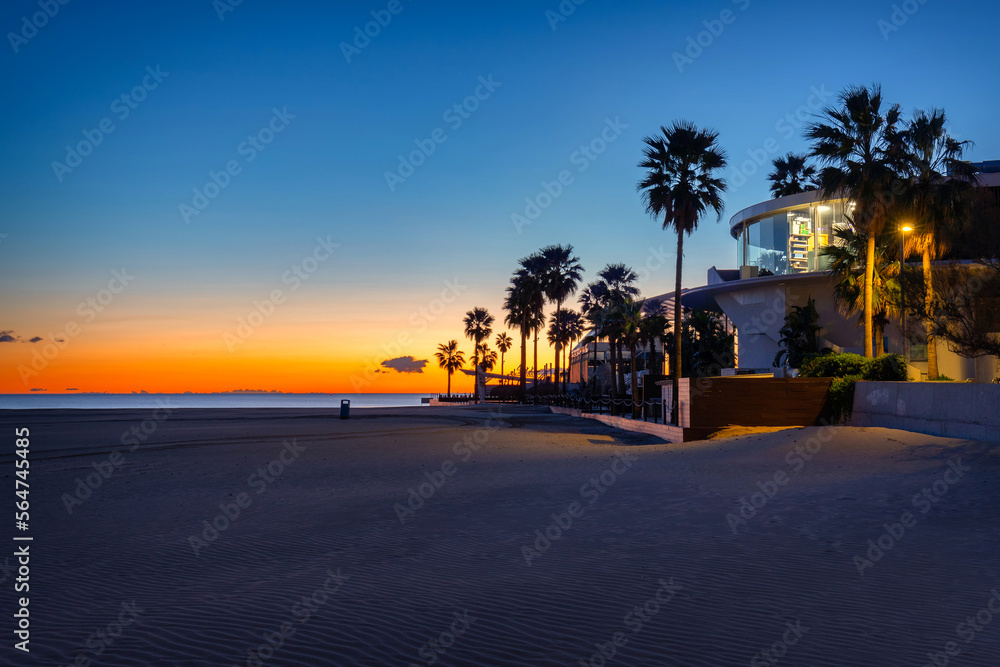 Palm trees on Playa de las Arenas beach at sunrise, Valencia. Spain Palm trees on Playa de las Arenas beach at sunrise, Valencia. Spain