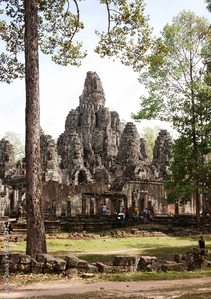 Angkor Wat temple by trees against sky Angkor Wat temple by trees against sky