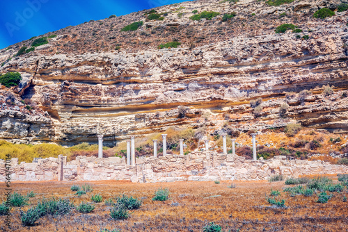 Ruins of the ancient city of Kourion. The columns are set against a rock with strange horizontal crevices and ancient artifacts.aliens, ancient, ancient city, ancient greek, antique, antiquity, archae