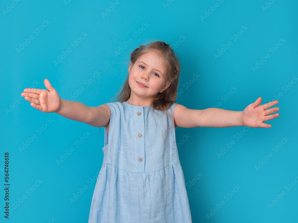 Let’s hug. Girl happy smiling  on blue background.