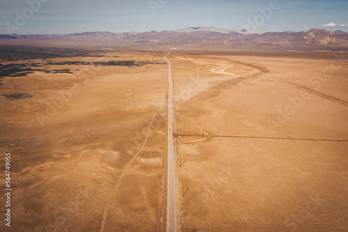 A lonely road through the Californian desert from above photo