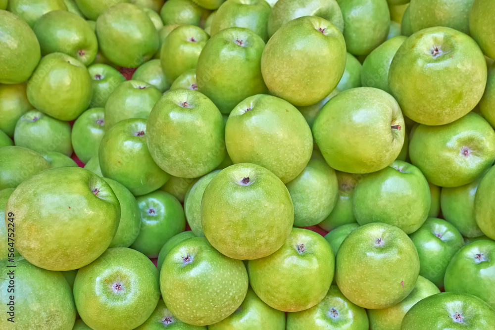 Bright green, fresh apples top view close-up. Natural, juicy background.