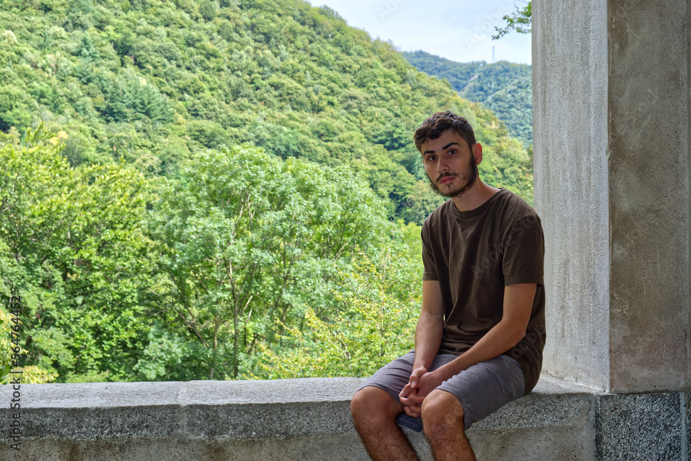 a sitted caucasian boy looking at camera a sitted caucasian boy looking at camera
