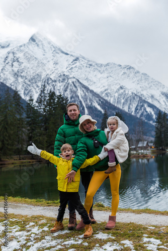 Family having the holiday at Gaillands lake in Chamonix, french alps.