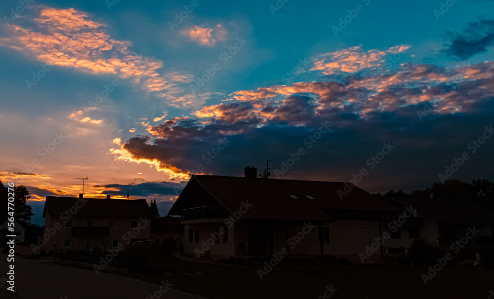 Beautiful sunset with a dramatic sky near Tabertshausen, Bavaria, Germany