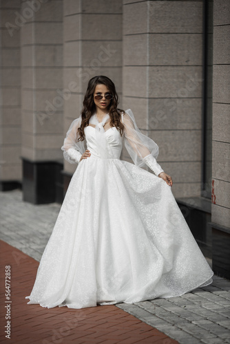 stylish caucasian bride in white wedding dress  