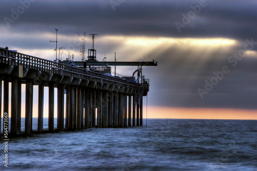 Wallpaper Mural Shafts of light penetrate the clouds on a surreal afternoon at Scripps Pier in La Jolla, CA. Torontodigital.ca