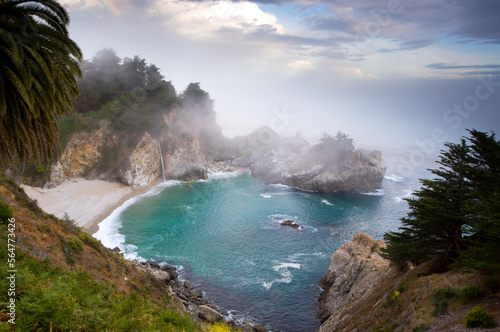 Fog rolls in at the classic Big Sur overlook in Julia Pfeiffer Burns State Park in California. photo
