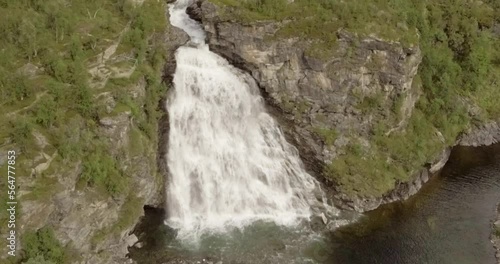 Aerial view of  Rovijokkfossen waterfall on the E8 Nordlysveien road in summer, Storfjord, Troms og Finnmark, Norway. photo