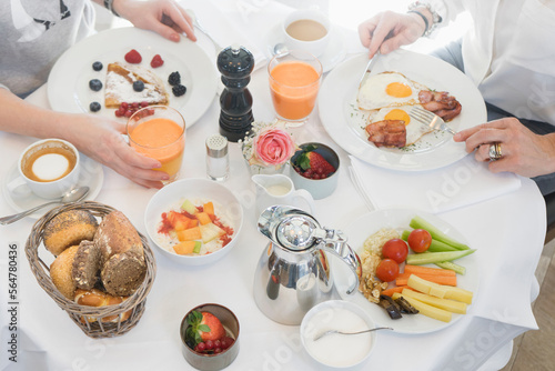 Wallpaper Mural Women having breakfast on table Torontodigital.ca