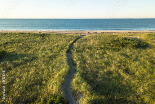 Path leading to Atlantic Ocean through sand dune grass at Napatree Point, Watch Hill, Westerly, Rhode Island, USA photo