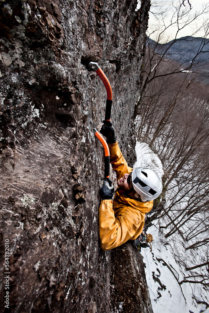 An ice climber weaves his way up