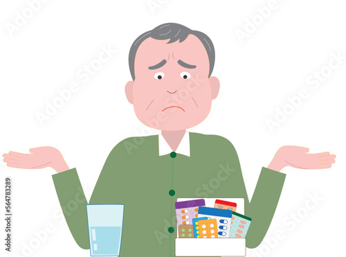 たくさんの薬を飲んでいる高齢者が嫌な顔をしている。