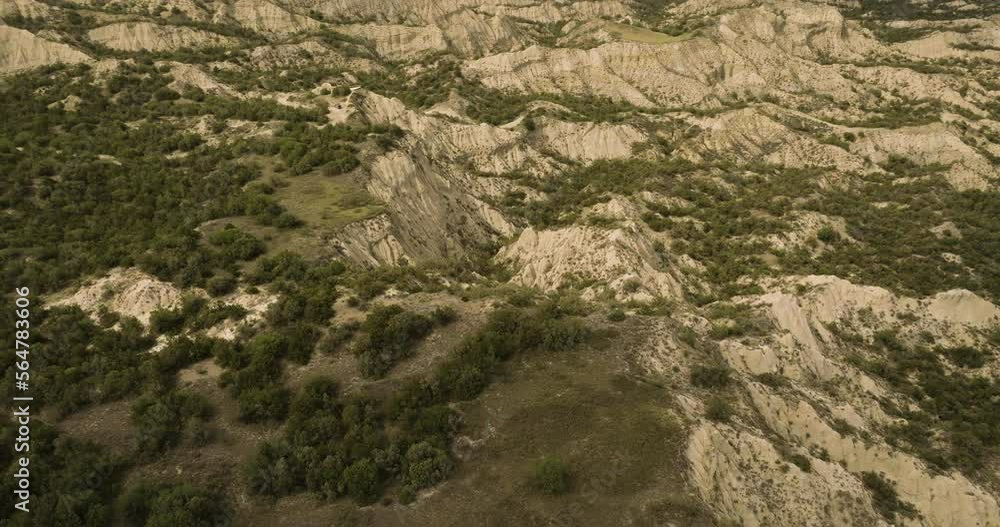 Rocky cliffs with bushes above eroded ravines in Vashlovani, Georgia. Rocky cliffs with bushes above eroded ravines in Vashlovani, Georgia.