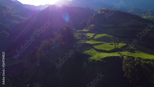 Orbit Shot Of Sunlight Over Wide Green Mountains Landscape, Obrajillo, Peru photo