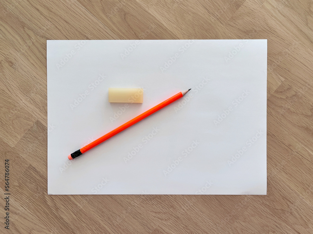 pencil and eraser on white paper, paper and pencil on wood table. pencil and eraser on white paper, paper and pencil on wood table.