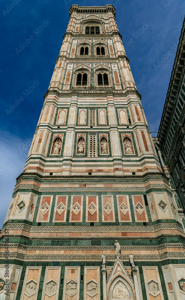 Marble facade of Giotto Campanile bell tower at the Duomo in Florence, Italy. Marble facade of Giotto Campanile bell tower at the Duomo in Florence, Italy.