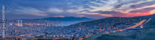 Valokuva panoramic view of izmir city at evening, highway with lights of cars and colorfu