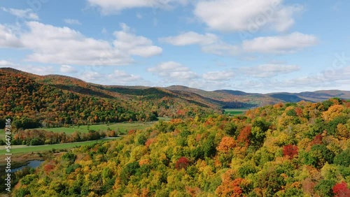 Aerial drone shot of beautiful Vermont mountains during peak fall foliage