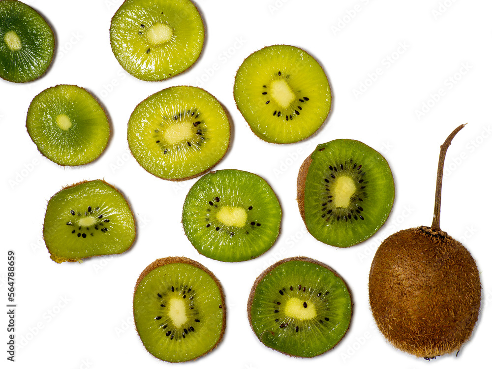 Fototapeta premium Round kiwi slices on a white background. The concept of juicy ripe fruit. Place for an inscription. raw food diet. Ingredient for many dishes. Southern fruit.