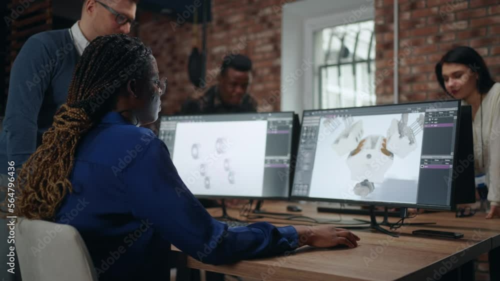 multi ethnic team of professional engineers and designers creating 3D visualization of engine multi ethnic team of professional engineers and designers creating 3D visualization of engine