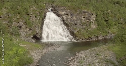 Aerial view of  Rovijokkfossen waterfall on the E8 Nordlysveien road in summer, Storfjord, Troms og Finnmark, Norway. photo